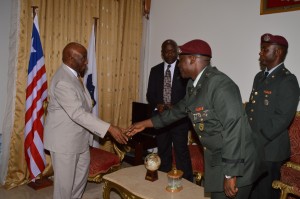 Vice President Boakai Shakes Hands with Lt. Col. Forleh